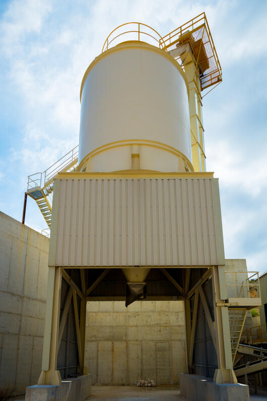 Processing facility with engineered support frames and elevated equipment platforms.